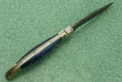 Laguiole Folding Damascus steel knife, 8.6" Long with 4" hand forged custom twist pattern Blade. Blue colored wood with brass bolster, Cow hide leather sheath included